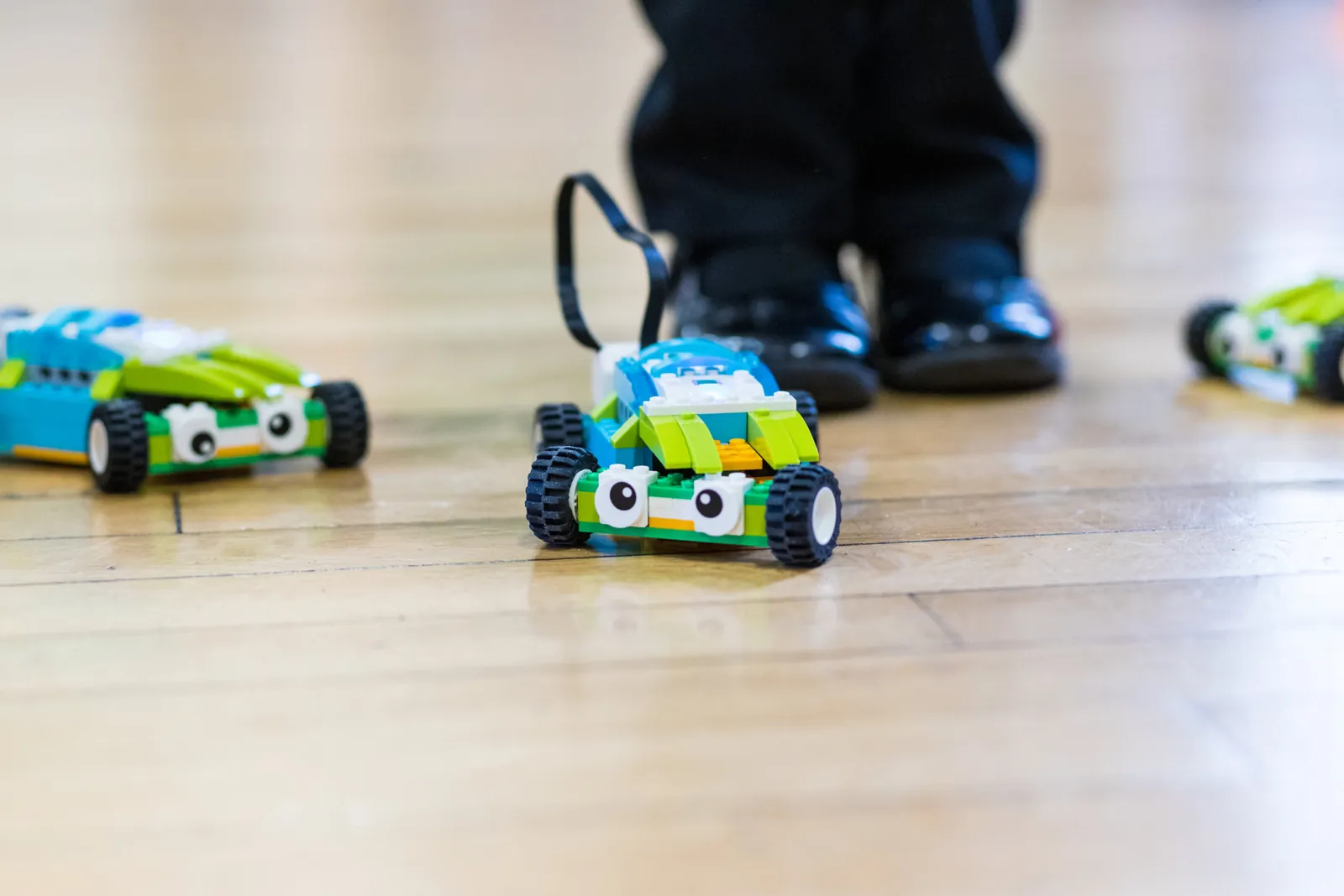 A pupil-built programmable robot car on a classroom floor